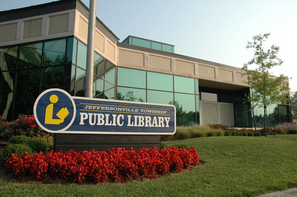 Photograph of the Jeffersonville Library from Court Avenue, including the sign reading "Jeffersonville Township Public Library". Photo by Tim Bohannon