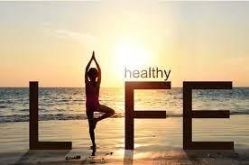 image of person doing yoga on the beach