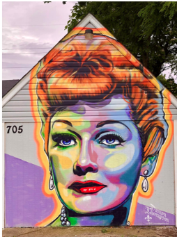 Photograph of a Lucille Ball painting across a shed