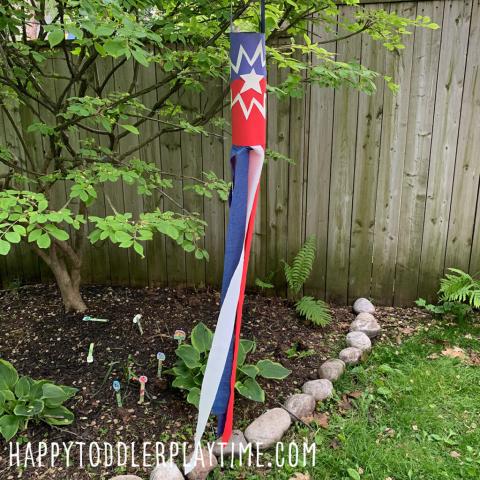 picture of a windsock with a 12 pointed starburst pattern in red, white, and blue