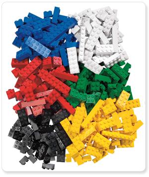 Pile of LEGO bricks sorted by color: blue, red, white, green, yellow, black, and gray.