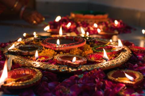 Photo of candles and flowers for diwali celebration 