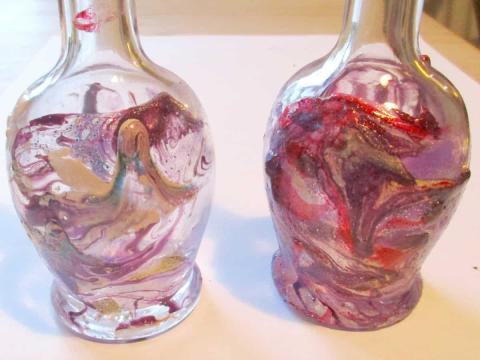 Marbled vases made with nail polish.