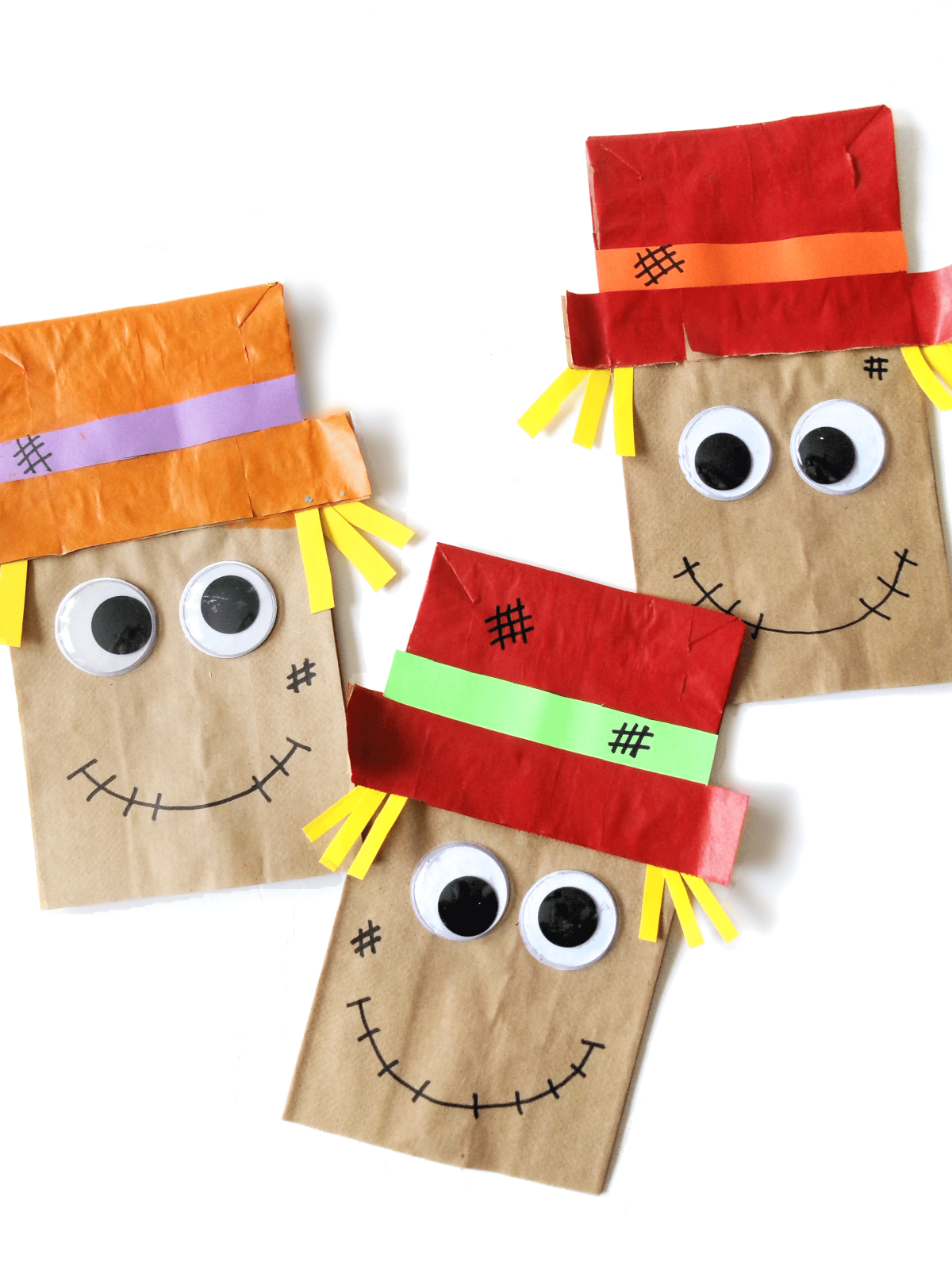 Photo of 3 scarecrows made from paper lunch bags